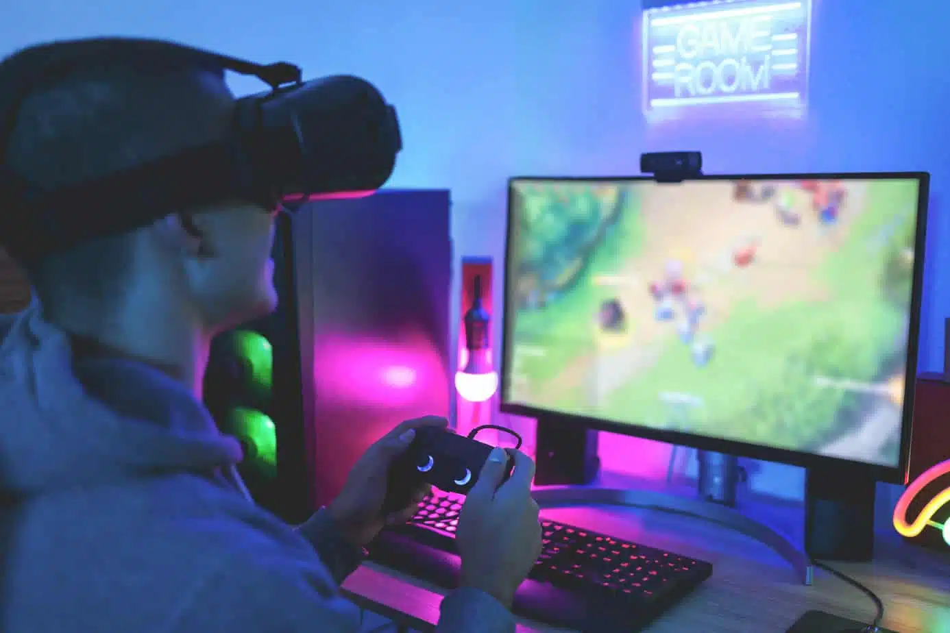 Gamer playing at computer game using joypad - Young man streamin → Social Kings Grow your following